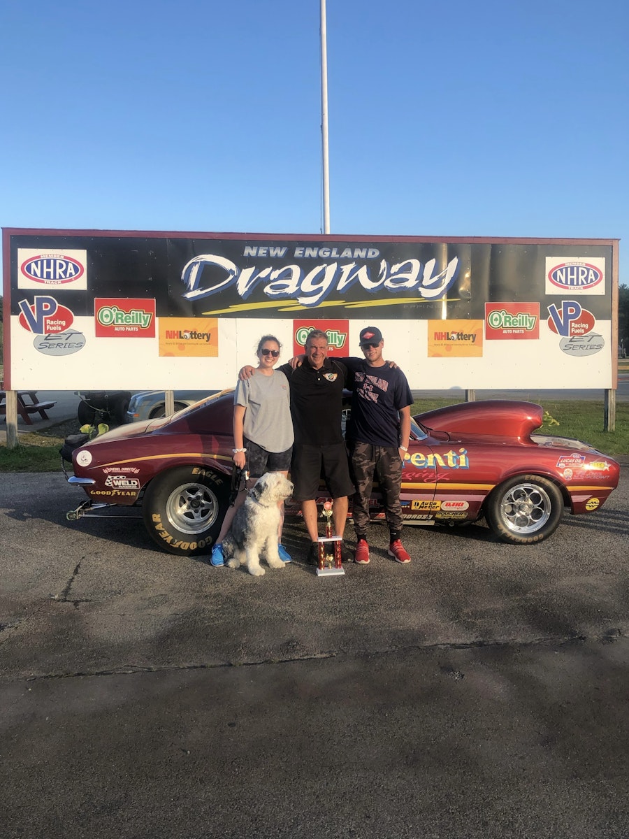 Michelle and her family in the New England Dragway's winner's circle with their 67 Camaro